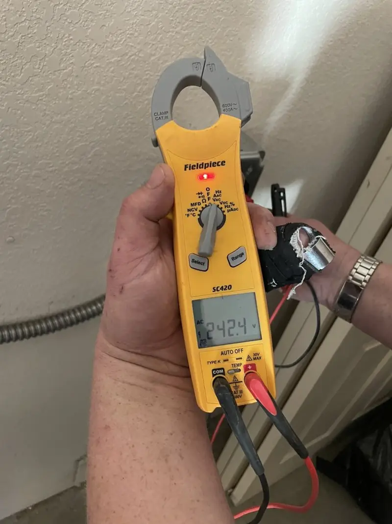 Voltage testing with clamp meter during Recessed Lighting Installation in Port Orchard